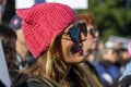 Side View of Tanned Woman Wearing a Pink Pussyhat