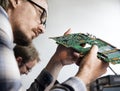 Side view of technician working on computer mainboard Royalty Free Stock Photo