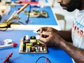 Side view of technician working on computer mainboard Royalty Free Stock Photo