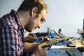 Side view of technician working on computer mainboard Royalty Free Stock Photo