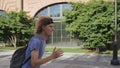 Side view of teenage boy with back pack running to school being late Royalty Free Stock Photo