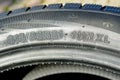 Side view of tire with tire width, height and wheel diameter designations, speed and load indices