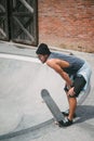 side view of tired handsome skater resting Royalty Free Stock Photo