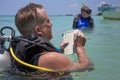 Panglao, Philippines - April 29, 2021: Scuba diver in confined water teaching, studying, evaluating skills