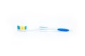 Side view of a toothbrush with blue inserts