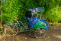 Side view of a traditional Asian cycle rickshaw, Vintage transportation vehicle from Asia