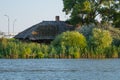 Side view of a traditional house in the Danube delta Sulina, covered with reeds
