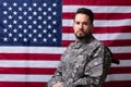 Veteran Sitting In Wheelchair In Front Of An American Flag Royalty Free Stock Photo