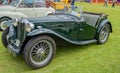 Vintage open top convertible Morgan sports car on display at a public car show