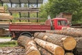Side view of a vintage 662N1 fiat truck in an Italian sawmill. Vintage transportation truck. Logs in the foreground. Royalty Free Stock Photo
