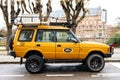 Side view of Vintage new yellow Land Rover