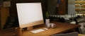 Side view, Vintage wood table with electronic devices, computer mockup Royalty Free Stock Photo