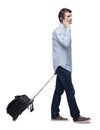 Side view of walking business man with suitcase talking on the phone Royalty Free Stock Photo