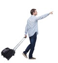 Side view of walking pointing business man with suitcase Royalty Free Stock Photo