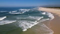 Side view of waves crashing on sandy beach Royalty Free Stock Photo