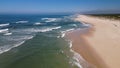 Side view of waves crashing on sandy beach Royalty Free Stock Photo