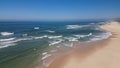 Side view of waves crashing on sandy beach Royalty Free Stock Photo