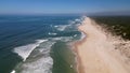 Side view of waves crashing on sandy beach Royalty Free Stock Photo