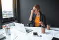 Tired lady having job with notebook computer