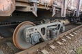 Side view of wheel wagon of old rusty freight train Royalty Free Stock Photo