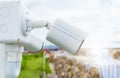 Side view of white CCTV security camera video system for safety at a paper recycling factory. Closed-circuit television. CCTV Royalty Free Stock Photo