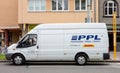 Side view of white delivery Ford Transit van of PPL company, partner of global DHL postal service, parked when delivering parcels