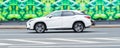 Side view of a white Lexus RX car fourth generation AL20 in motion on highway road Royalty Free Stock Photo