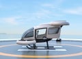 Side view of white self-driving passenger drone parking on the helipad