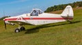 The side view of the wings, nose and propeller of Piper PA-25 Pawnee tow aircraft