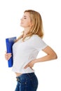 Side view of woman with back pain holding a binder Royalty Free Stock Photo