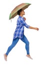 Side view of a woman balancing with an umbrella. girl jumps over a puddle