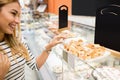 Side view of woman choosing dessert Royalty Free Stock Photo