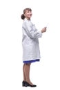 Side view of woman doctor, holding tablet computer and smiling Royalty Free Stock Photo