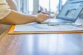 Side view of woman hands typing laptop keyboard at office Royalty Free Stock Photo