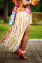 Side view of woman legs in hawaiian costume Royalty Free Stock Photo