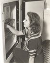 Side view of woman looking through refrigerator Royalty Free Stock Photo