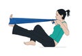 Side view of woman pulling expander while exercising leg and doing pilates.