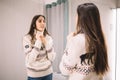 Side view of woman with reindeer sweater