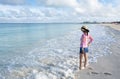 Side View of Woman Standing on a Caribbean Beach 1 Royalty Free Stock Photo