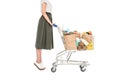 side view of woman standing with shopping trolley with paper bags and grocery