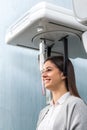 Side view of woman taking 3D panoramic dental x-ray. Royalty Free Stock Photo