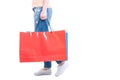 Side view of woman walking and carrying big shopping bags Royalty Free Stock Photo