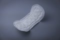 Side view of women sanitary pad on grey background