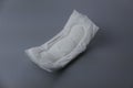 Side view of women sanitary pad on grey background