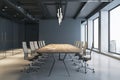 Side view on wooden meeting table and light wheel chairs sunlit by modern chandelier on dark top in spacious conference room with Royalty Free Stock Photo