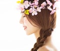 Side view of young smiling beauty face with flower Royalty Free Stock Photo