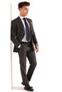 Side view of a young business man leaning on wall Royalty Free Stock Photo