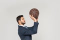 side view of young businessman throwing basketball ball Royalty Free Stock Photo