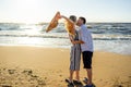 side view of young couple in love kissing on sandy beach Royalty Free Stock Photo
