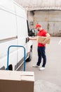 side view of young delivery man Royalty Free Stock Photo